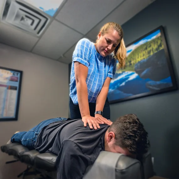 Chiropractor Adjusting Patient